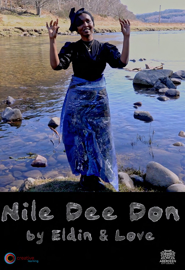 film poster: a black woman in a blue paper skirt with drawings on it and a black head wrap with a big floppy bow, stands with arms uplifted, performing, before a blue highland river. Words in semitransparent splurgy letters, white on black, say: Nile Dee Don by Eldin & Love. Some sponsorship logos in bottom corners