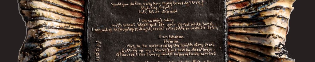 embossed ceramic panel, dark brown and golden glazed rays around a poem